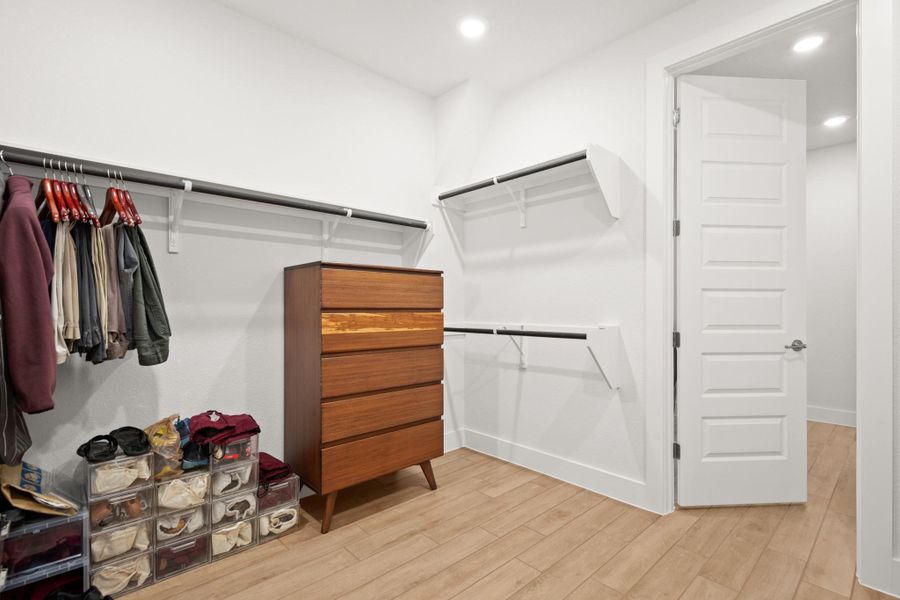 Spacious closet with light wood-type flooring