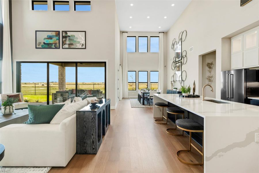 Living area featuring light wood finished floors and recessed lighting Living area featuring light wood finished floors and recessed lighting
