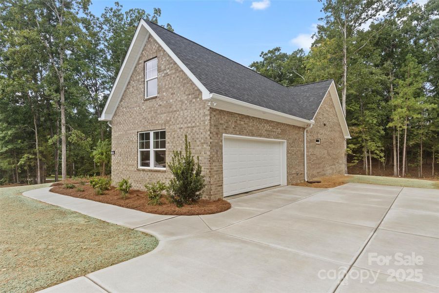 Front exterior of a new home in , Lancaster, SC, highlighting curb appeal (Image 17).