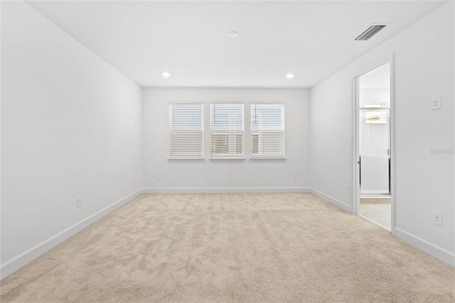Spacious, unfurnished interior of a new home in Harvest At Ovation 50s, Winter Garden (Image 40).