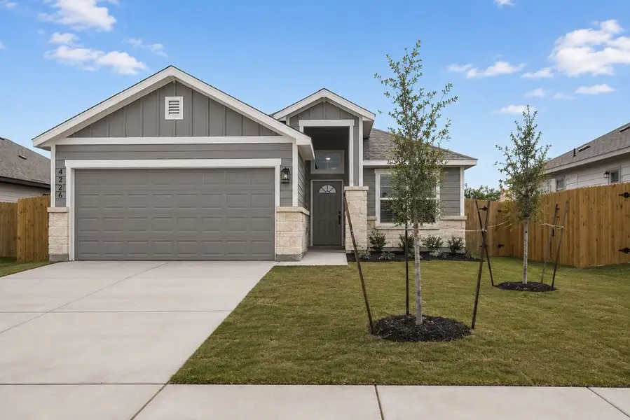 Front exterior of a new home in Yowell Ranch, Killeen, TX, highlighting curb appeal (Image 1). Front exterior of a new home in Yowell Ranch, Killeen, TX, highlighting curb appeal (Image 1).