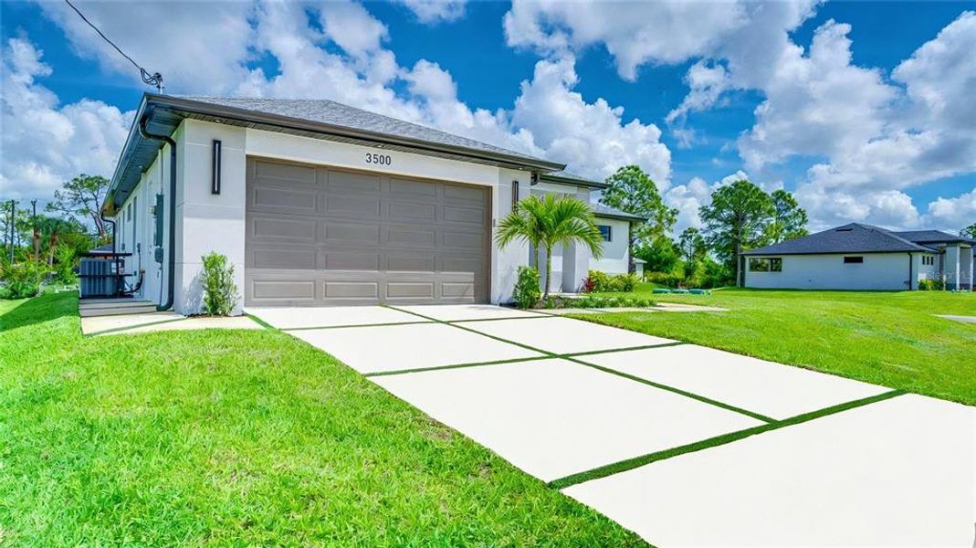 Front exterior of a new home in , Lehigh Acres, FL, highlighting curb appeal (Image 28).
