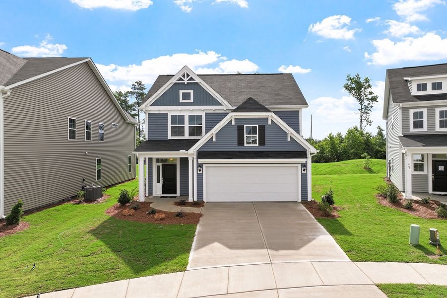 Front exterior of a new home in Renaissance at White Oak, Garner, NC, highlighting curb appeal (Image 1). Front exterior of a new home in Renaissance at White Oak, Garner, NC, highlighting curb appeal (Image 1).