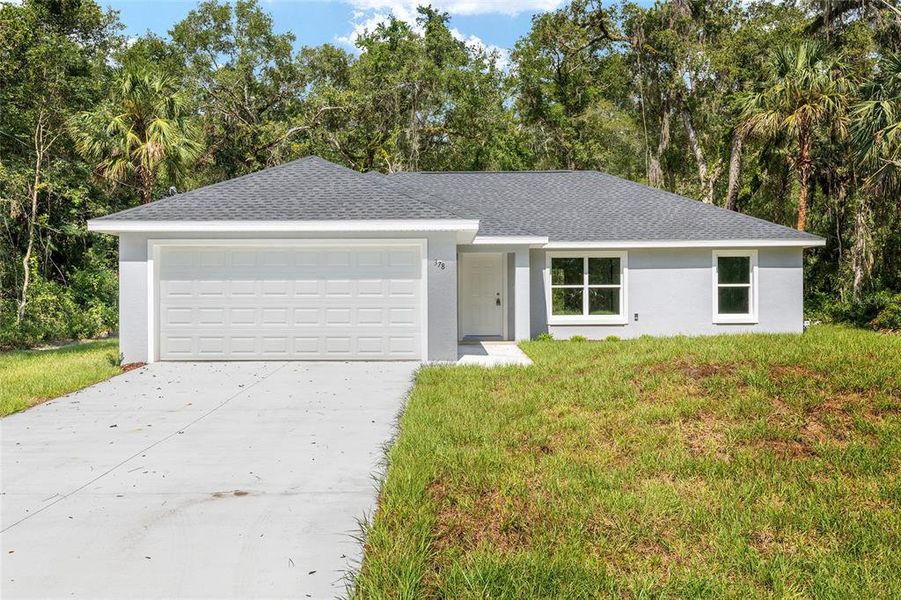 Front exterior of a new home in , Ocklawaha, FL, highlighting curb appeal (Image 16).