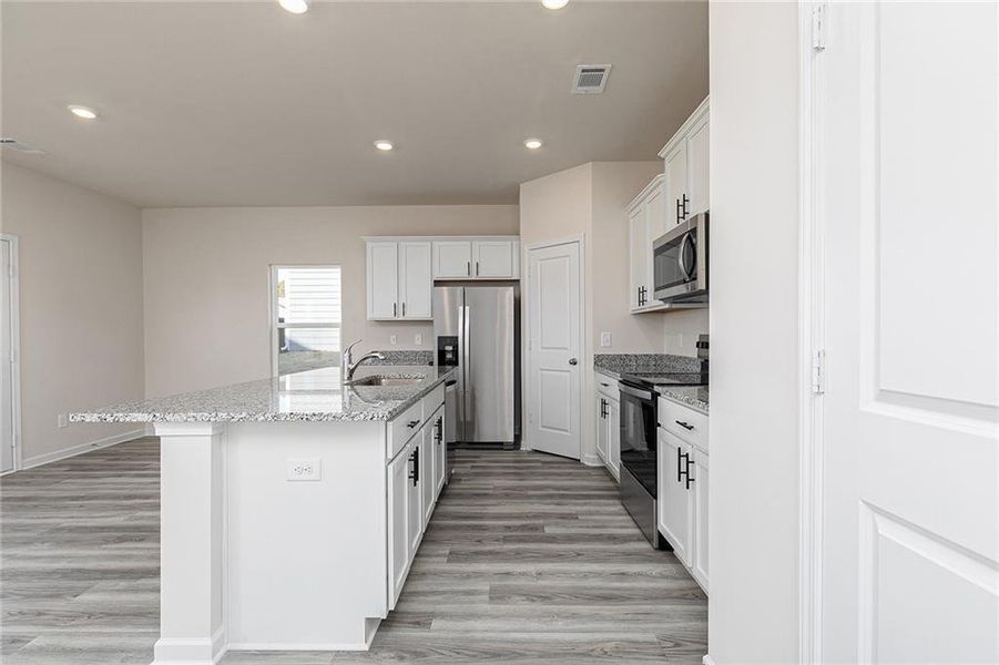 Furnished interior view inside a new home in Conners Landing at Mirror Lake, Villa Rica (Image 8).