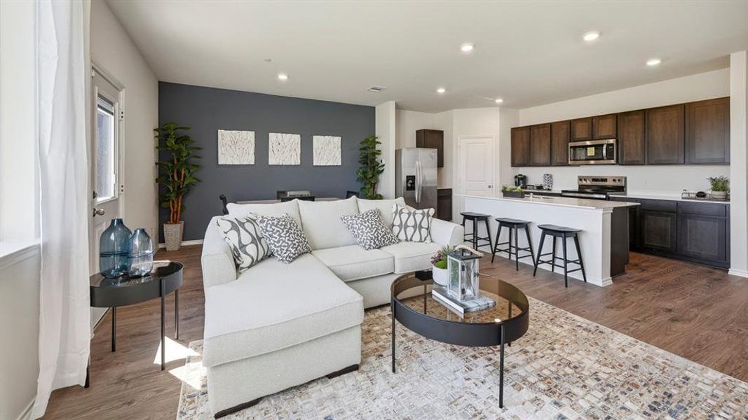 Living area featuring dark wood finished floors and recessed lighting Living area featuring dark wood finished floors and recessed lighting