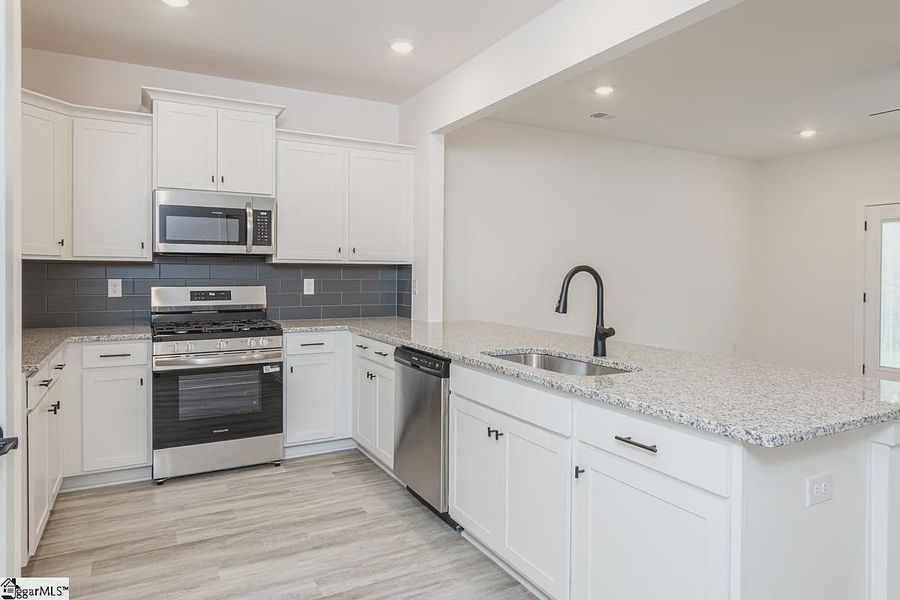 Representative furnished interior of a home built from the 1568 Townhome by Adams Homes in Parkstone Place Townhomes, Roebuck (Image 6). Representative furnished interior of a home built from the 1568 Townhome by Adams Homes in Parkstone Place Townhomes, Roebuck (Image 6).