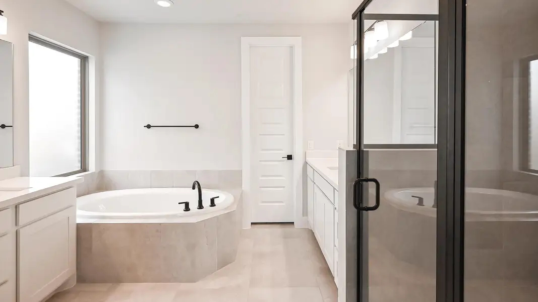 Bathroom with vanity, a garden tub, a stall shower, recessed lighting, and tile patterned flooring