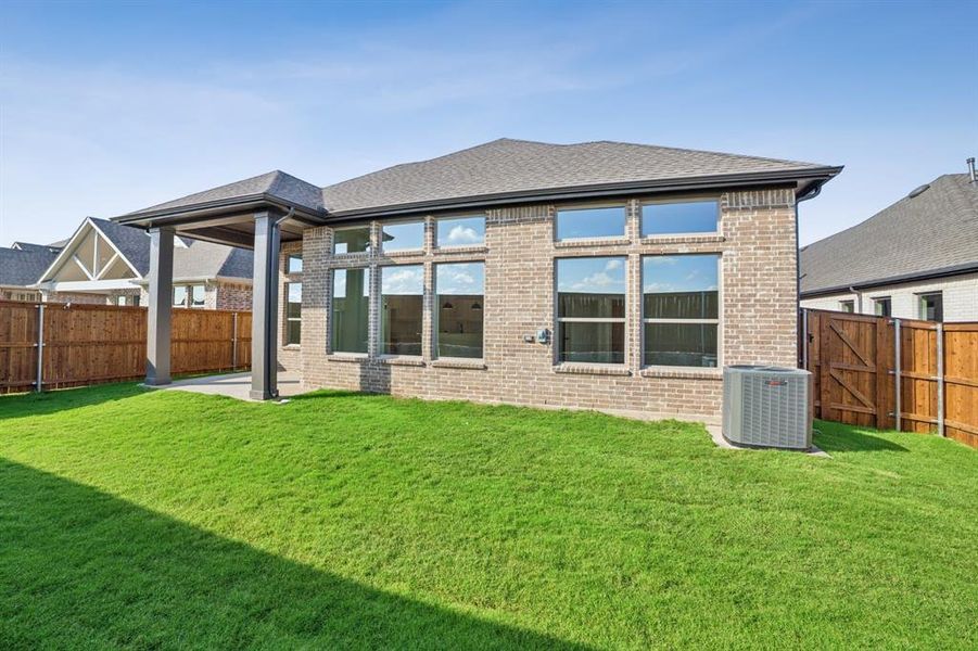 Exterior details and patio area of a home in Creekshaw – Classic, Royse City (Image 20).