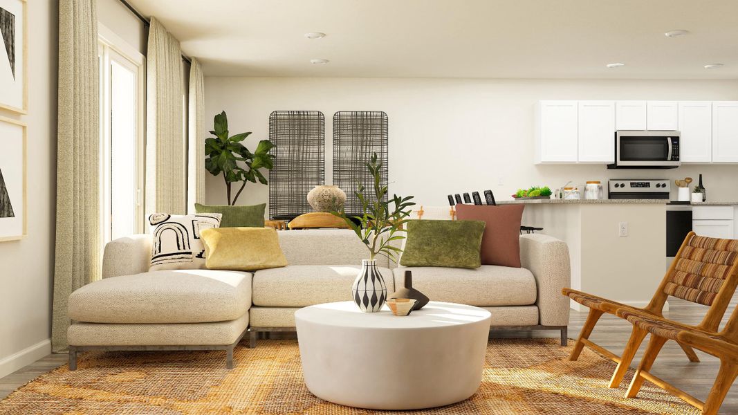 A living room with a white couch and a table. A living room with a white couch and a table.