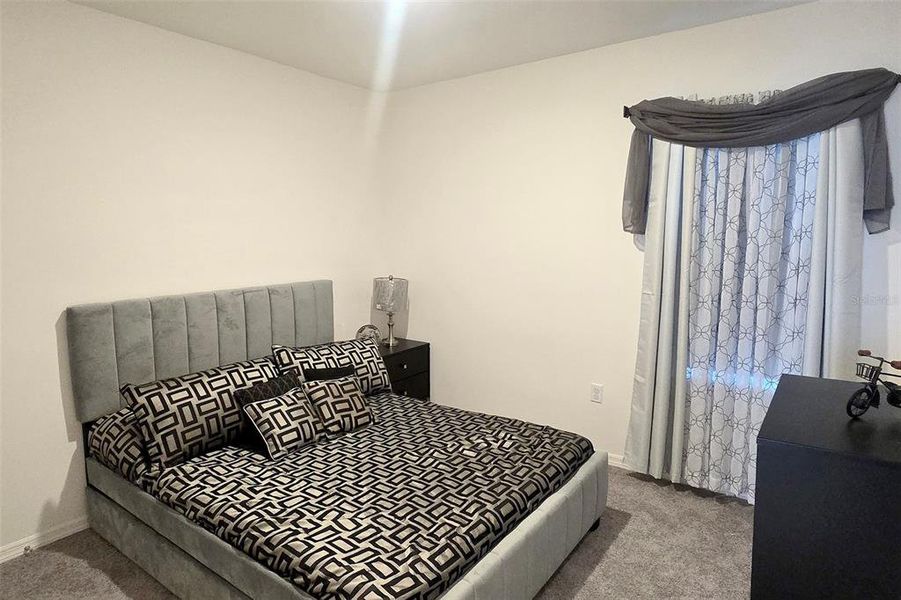 Furnished interior view inside a new home in Hammock Reserve, Haines City (Image 8).