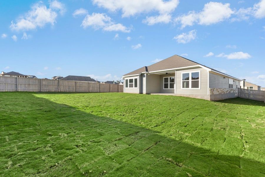 Exterior details and patio area of a home in The Colony, Bastrop (Image 21).