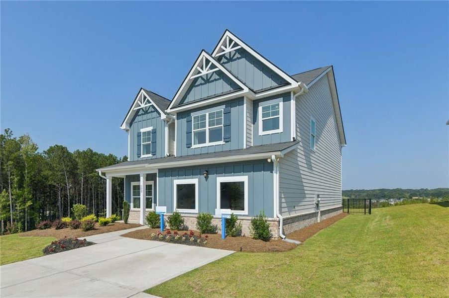 Front exterior of a new home in The Hills at Cedar Creek, Winder, GA, highlighting curb appeal (Image 23). Front exterior of a new home in The Hills at Cedar Creek, Winder, GA, highlighting curb appeal (Image 23).