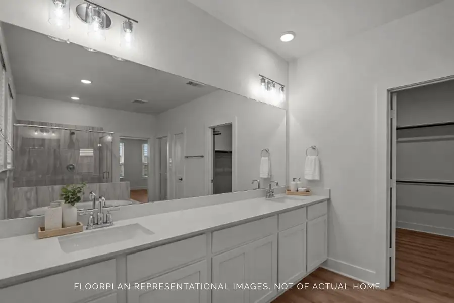 Furnished interior view inside a new home in The Oaks on 6th Street, Magnolia (Image 17).