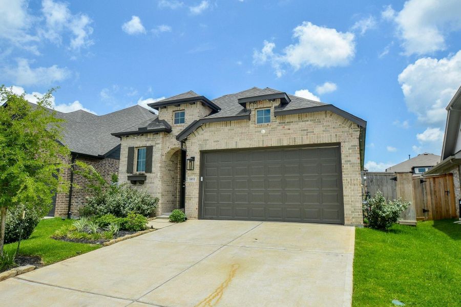 Charming brick exterior with inviting curb appeal and modern design. Charming brick exterior with inviting curb appeal and modern design.