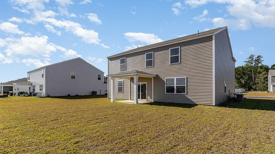 Front exterior of a new home in Auberon Woods, Conway, SC, highlighting curb appeal (Image 12).