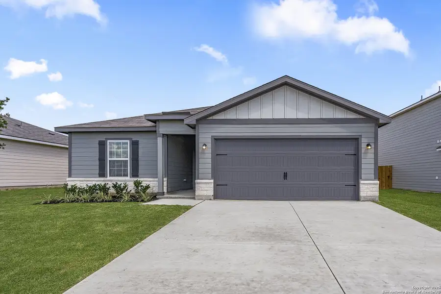 Front exterior of a new home in Rosewood Estates, Lytle, TX, highlighting curb appeal (Image 1).