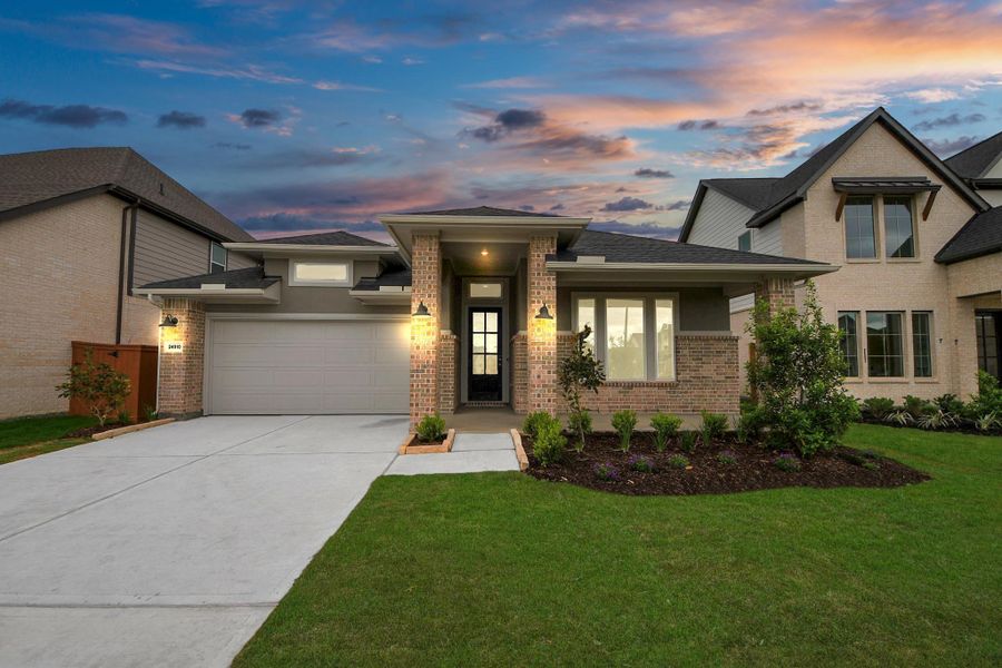 Front exterior of a new home in 50' Traditional Homes at Elyson, Katy, TX, highlighting curb appeal (Image 26). Front exterior of a new home in 50' Traditional Homes at Elyson, Katy, TX, highlighting curb appeal (Image 26).