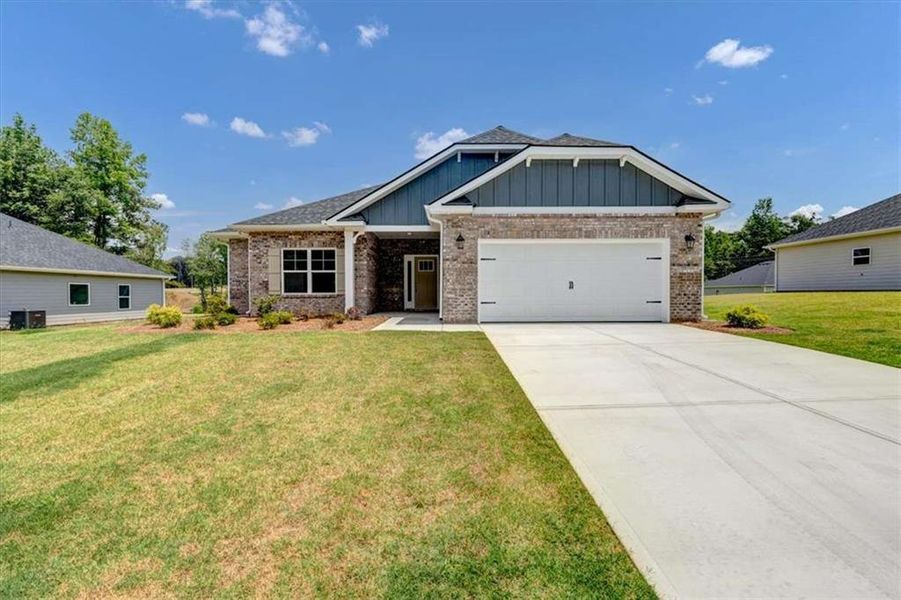 Front exterior of a new home in Park Place, Bowdon, GA, highlighting curb appeal (Image 2). Front exterior of a new home in Park Place, Bowdon, GA, highlighting curb appeal (Image 2).
