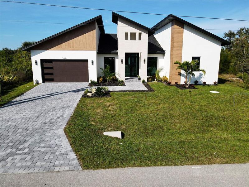 Front exterior of a new home in , Port Charlotte, FL, highlighting curb appeal (Image 2). Front exterior of a new home in , Port Charlotte, FL, highlighting curb appeal (Image 2).