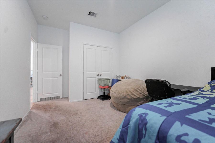 Light and bright third bedroom offers flexibility for a home office, playroom, or guest space in this desirable Katy home. Light and bright third bedroom offers flexibility for a home office, playroom, or guest space in this desirable Katy home.