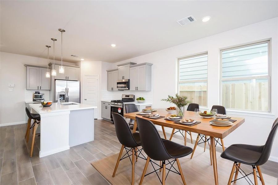 This dining area is perfect for casual meals or hosting gatherings. This dining area is perfect for casual meals or hosting gatherings.