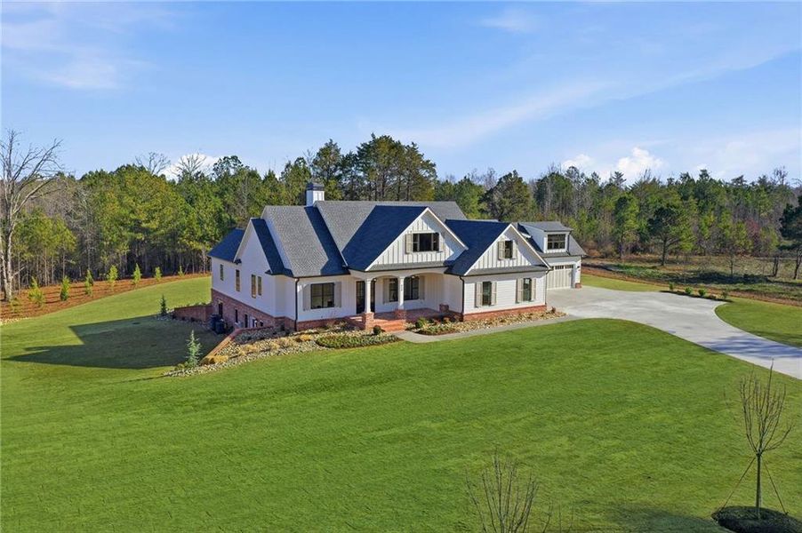 Front exterior of a new home in , White, GA, highlighting curb appeal (Image 34). Front exterior of a new home in , White, GA, highlighting curb appeal (Image 34).