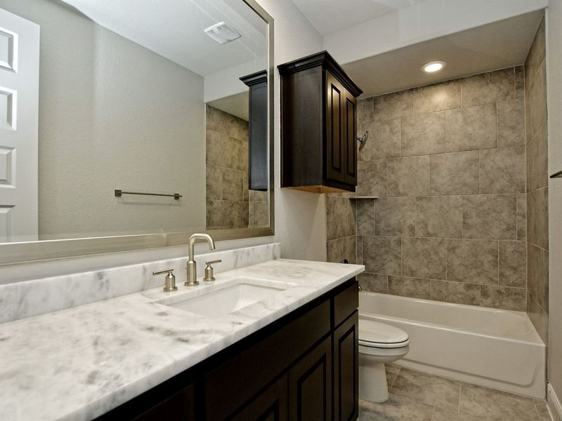 Representative furnished interior of a home built from the Madera II by Giddens Homes in Scofield Farms Estates, Georgetown (Image 229).