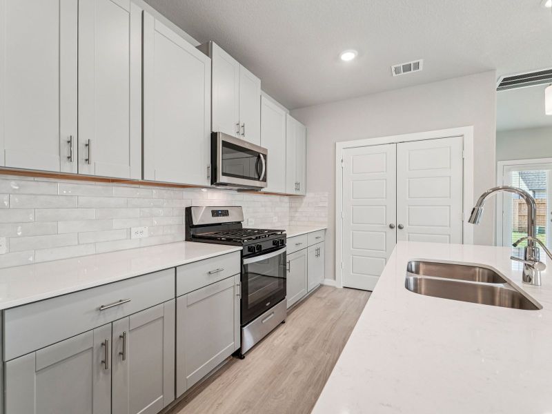 Furnished interior view inside a new home in Heights of Barbers Hill, Mont Belvieu (Image 3).