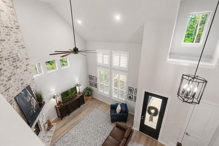 View of the living area from the loft/game room area upstairs