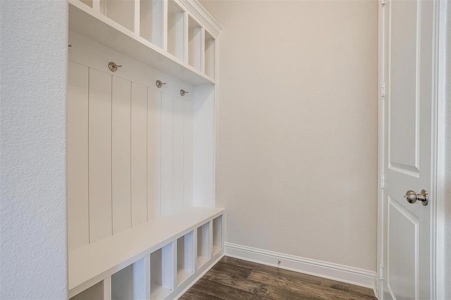 Mudroom with dark wood-type flooring