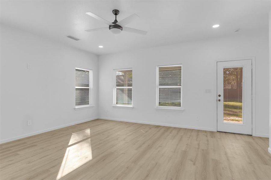 Unfurnished room with light wood-style floors, recessed lighting, and a ceiling fan