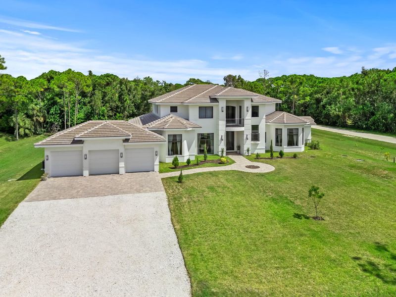 Front exterior of a new home in , Palm Beach Gardens, FL, highlighting curb appeal (Image 26).