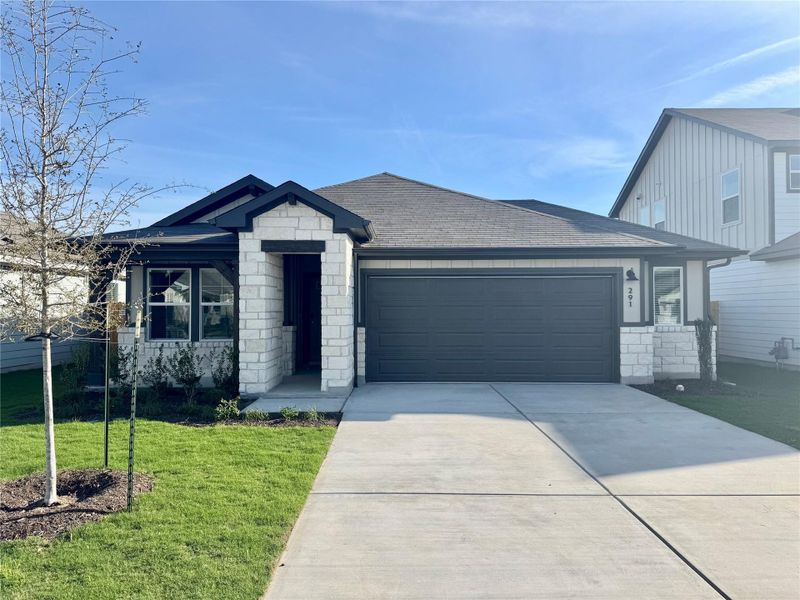 Front exterior of a new home in Waterstone Crossing, Kyle, TX, highlighting curb appeal (Image 1). Front exterior of a new home in Waterstone Crossing, Kyle, TX, highlighting curb appeal (Image 1).