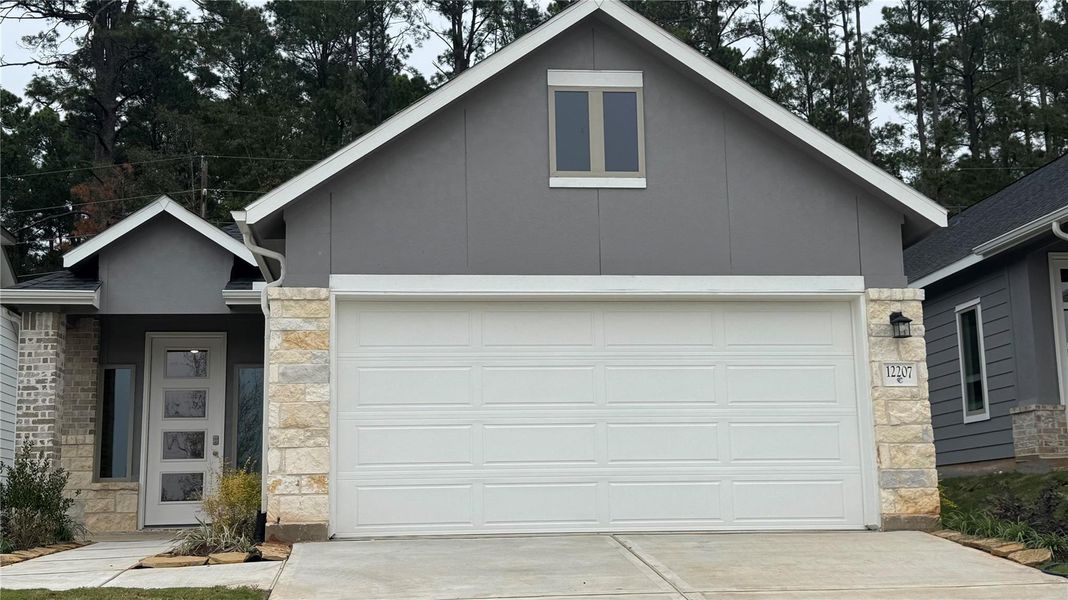 Front exterior of a new home in Westridge Cove, Conroe, TX, highlighting curb appeal (Image 20).