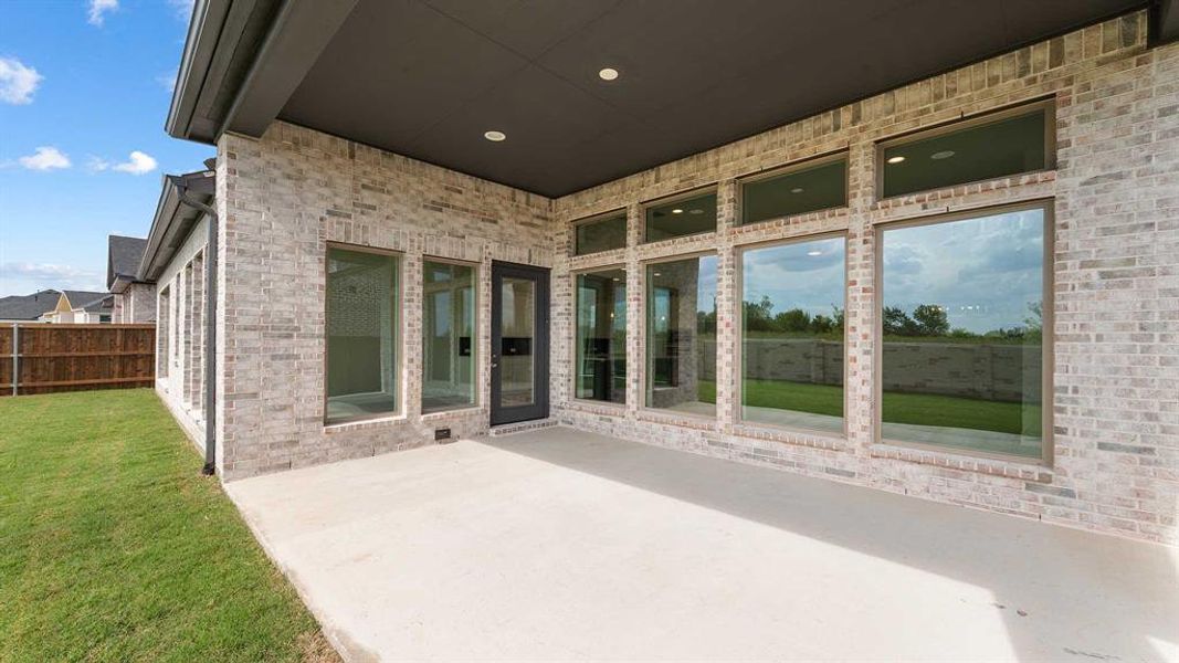 Exterior details and patio area of a home in Trinity Falls 60', McKinney (Image 4). Exterior details and patio area of a home in Trinity Falls 60', McKinney (Image 4).