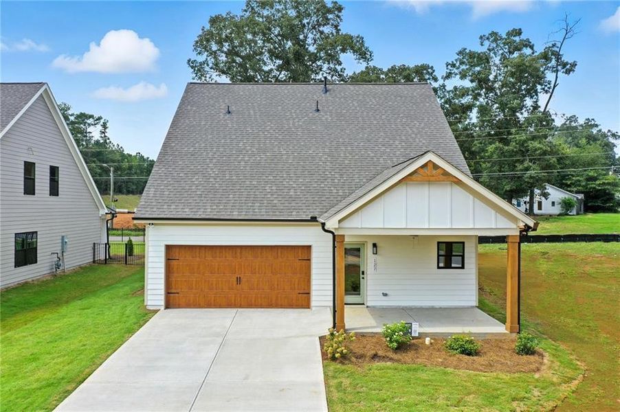 Front exterior of a new home in Ferguson Corners, Emerson, GA, highlighting curb appeal (Image 20). Front exterior of a new home in Ferguson Corners, Emerson, GA, highlighting curb appeal (Image 20).