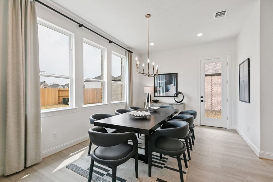 Representative furnished interior of a home built from the Premier Series - Mimosa by Brightland Homes in Anthem, Kyle (Image 11).