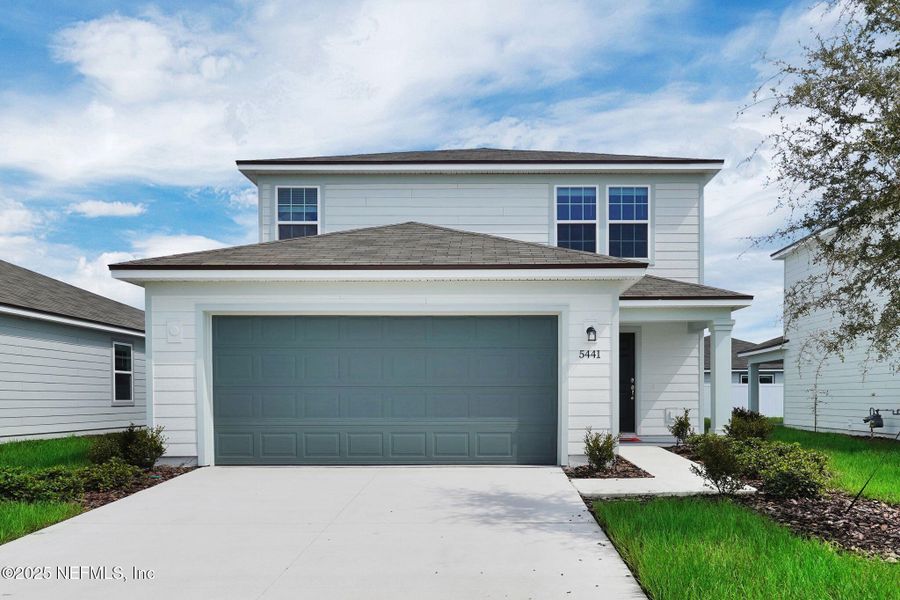 Front exterior of a new home in Wells Landing, Jacksonville, FL, highlighting curb appeal (Image 1). Front exterior of a new home in Wells Landing, Jacksonville, FL, highlighting curb appeal (Image 1).