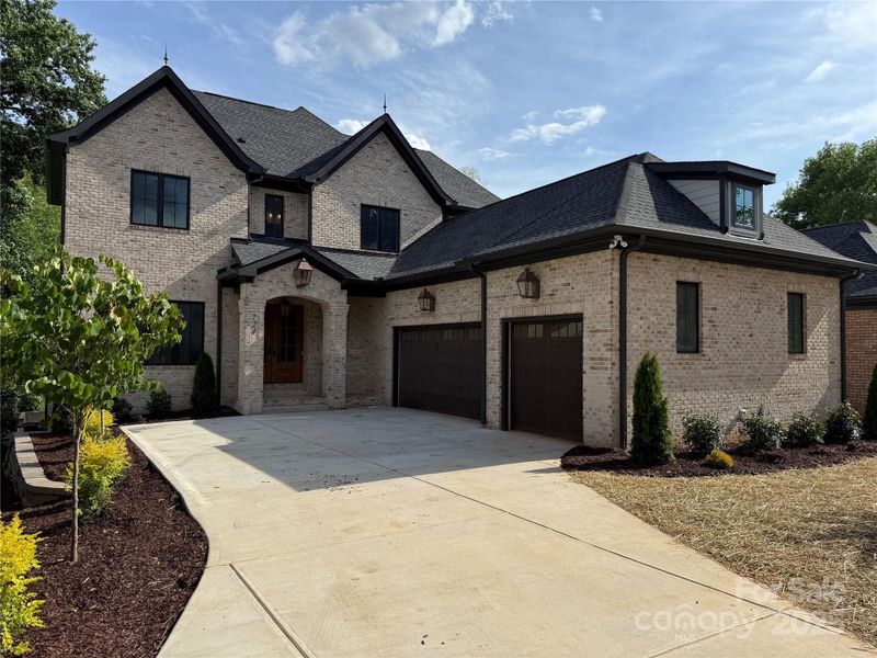 Front exterior of a new home in , Charlotte, NC, highlighting curb appeal (Image 1).