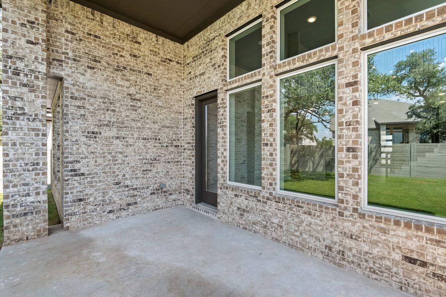 Exterior details and patio area of a home in Wolf Ranch, Georgetown (Image 24).
