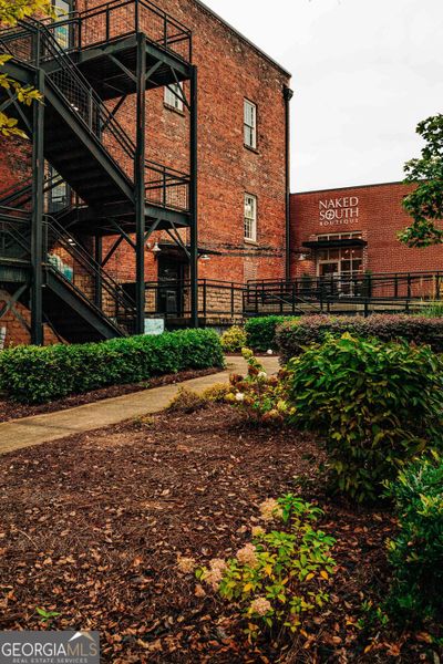 Front exterior of a new home in Rosewood Lake Estates, Hoschton, GA, highlighting curb appeal (Image 25).