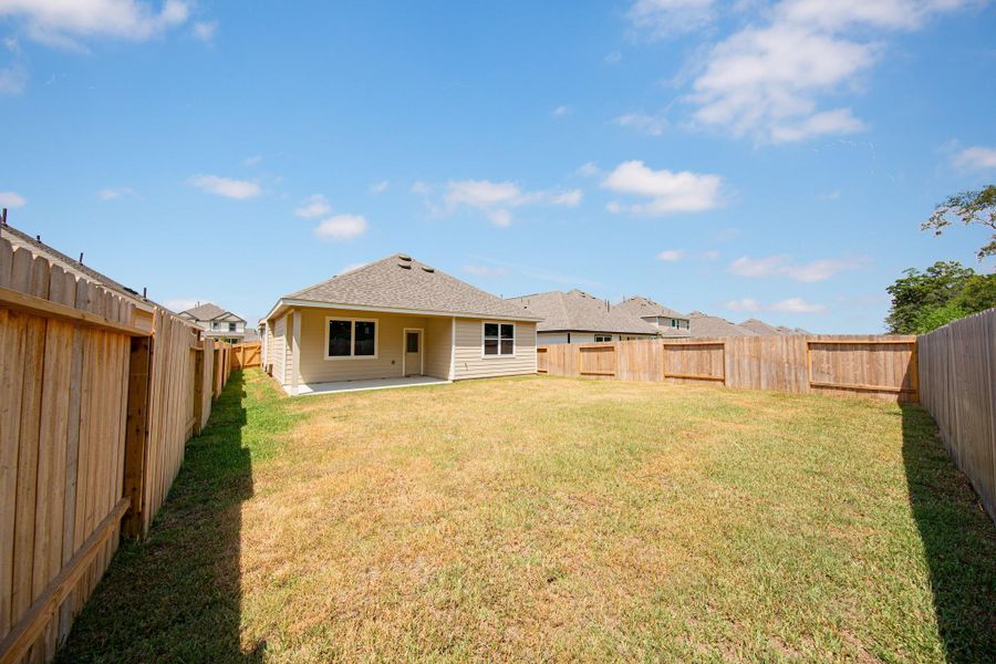 Exterior details and patio area of a home in Granger Pines, Conroe (Image 2). Exterior details and patio area of a home in Granger Pines, Conroe (Image 2).