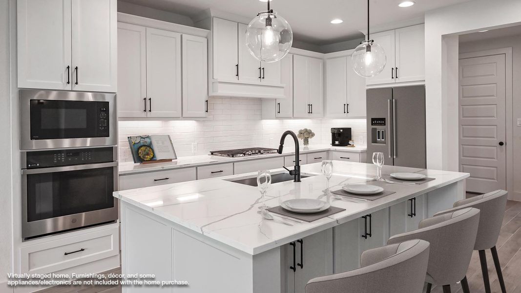 View of front of house with concrete driveway, an attached garage, brick siding, and a shingled roof