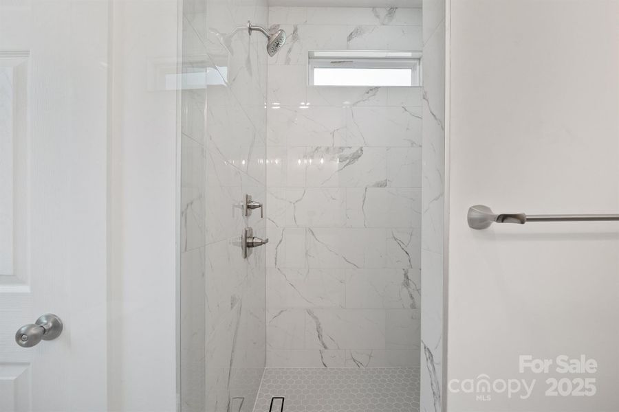 Beautiful shower with bench