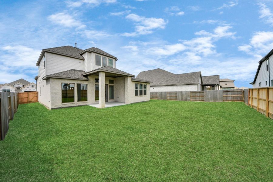 Front exterior of a new home in Marvida, Cypress, TX, highlighting curb appeal (Image 15). Front exterior of a new home in Marvida, Cypress, TX, highlighting curb appeal (Image 15).