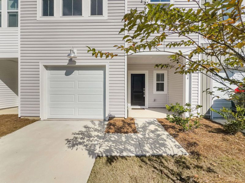 Exterior details and patio area of a home in Willow Bend Townhomes, North Charleston (Image 2). Exterior details and patio area of a home in Willow Bend Townhomes, North Charleston (Image 2).