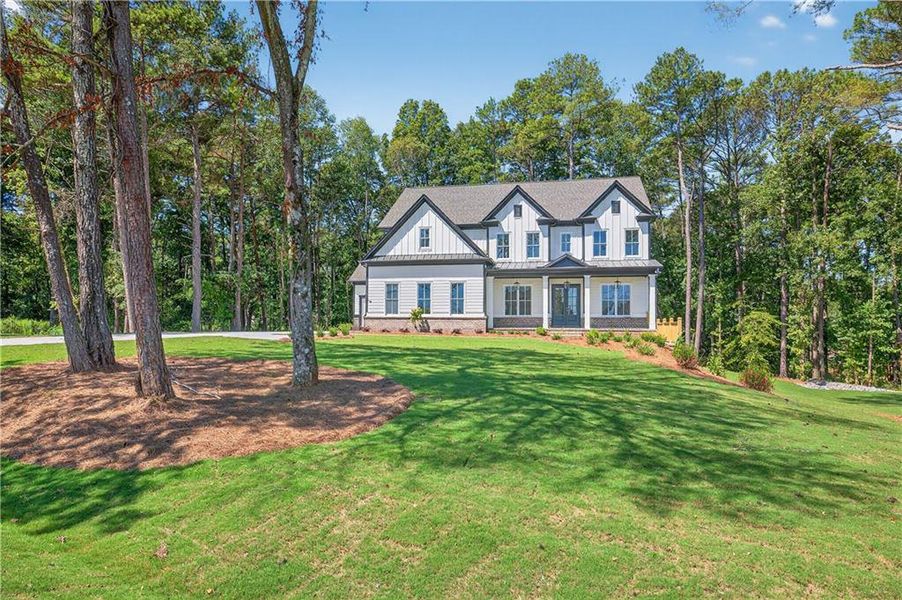 Front exterior of a new home in , Cumming, GA, highlighting curb appeal (Image 32). Front exterior of a new home in , Cumming, GA, highlighting curb appeal (Image 32).