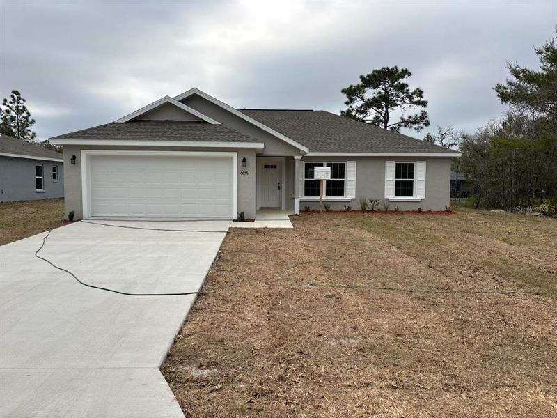 Front exterior of a new home in , Dunnellon, FL, highlighting curb appeal (Image 1). Front exterior of a new home in , Dunnellon, FL, highlighting curb appeal (Image 1).