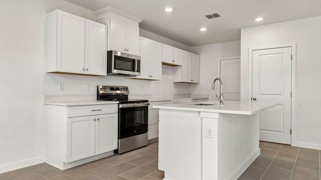 Furnished interior view inside a new home in Cyrene at Harmony, St. Cloud (Image 12).